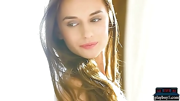 Perfect brunette babe gives a striptease and poses