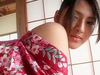 Nippon porn star's kimono-clad indoor pose brings XXX-cute bliss.